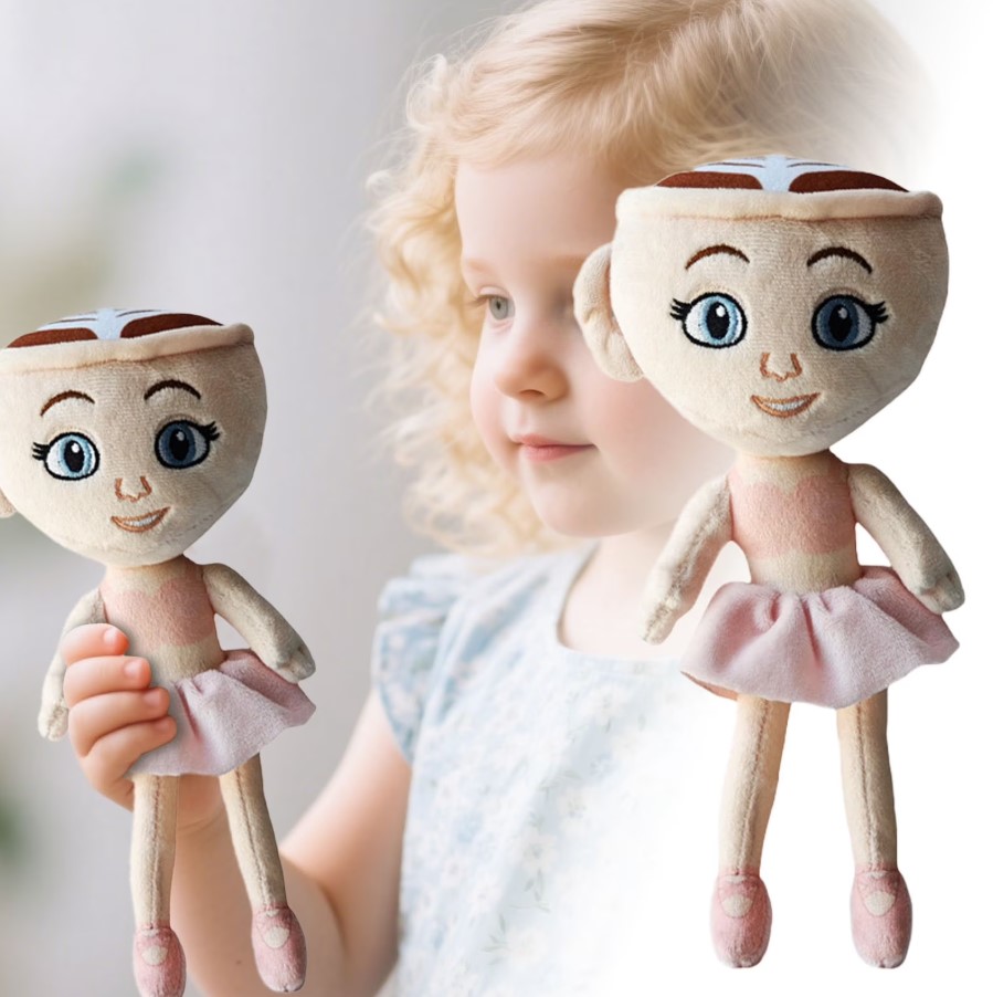 A soft Ballerina Cappuccina plush toy with an embroidered cup-shaped head and pink ballet costume, held up for detail